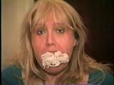 50 Yr OLD REAL ESTATE AGENT GETS HER MOUTH STUFFED, CLEAVE GAGGED & TIED TO A CHAIR (D62-7)