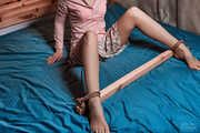 Sexual spreaded legs with jute and wood in pink clothes