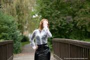 Miss Petra in a hot vinyl skirt, high heels and transparent blouse at photo shooting