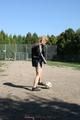 Leonie playing soccer outdoor wearing a sexy black shiny nylon shorts and a sexy black rain jacket (Pics)