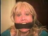 50 Yr OLD REAL ESTATE AGENT GETS HER MOUTH STUFFED, CLEAVE GAGGED & TIED TO A CHAIR (D62-7)
