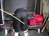 Watch Sandra beeing bound, gagged and spanked in her shiny nylon Rainsuit