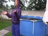 Watch Sandra enjoying Shower in her shiny nylon Downwear in the Garden