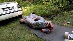 Dana & La Pulya - Driver Dana and hitchhiker La Pulya both wrapped and taped back to back (video)