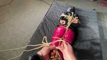 Marie M tightly bound and gagged in shiny nylon Rainwear