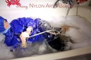 Sonja ties, gagges and hoodes herself in a bath tub wearing supersexy shiny nylon rainwear (Pics)