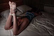 Rope hogtie in blue shirt