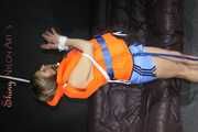Sexy Sandra being tied and gagged overhead with ropes and a ballgag wearing a sexy shiny nylon shorts and a lifevest (Pics)