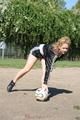 Leonie playing soccer outdoor wearing a sexy black shiny nylon shorts and a sexy black rain jacket (Pics)