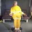 Sandra being tied and gagged on a hairdresser´s chair wearing sexy yellow shiny nylon rainwear being double hooded (Video)