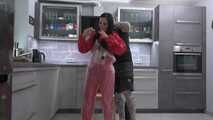 Miss Amira in red nylon rain gear and tranparent rain suit get´s bouind and gagged