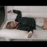 Samantha tied and gagged on a sofa wearing a shiny black rain jacket and a shiny white nylon shorts (Video)
