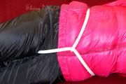 Mara tied and gagged on a red sofa wearing a sexy black rain pants and a shiny pink down jacket (Pics)