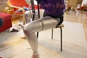 Mara tied and gagged with cable ties on a chair wearing a sexy shiny silver leggings and a shiny nylon shorts in black/white as well as a black purple rain jacket (Pics)