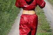 Watch Chloe outside wearing her shiny nylon Rainwear