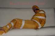 Watching Pia being tied and gagged with tape and a cloth gag wearing sexy yellow shiny nylon rainwear (Pics)