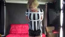 Sexy Pia wearing a sexy black shiny nylon shorts and a top being tied and gagged with ropes and a cloth gag overhead (Video)