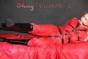 ***HOT***HOT***HOT***Mia wearing a sexy red shiny nylon jumpsuit and black shiny heel rubber boots being tied and gagged with belts and a clothgag (Pics)