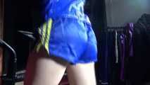 Sexy Sonja during her workout on the crosstrainer wearing a sexy blue/yellow shiny nylon shorts and a rain jacket (Video)