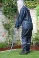 Watch Chloe enjoying her shiny nylon Rainwear doing some watering in the garden