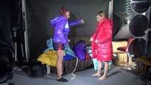 Watching sexy Stella and Sandra wearing a sexy shiny nylon shorts putting on several shiny nylon down jackets (Video)