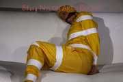 Watching Pia being tied and gagged with tape and a cloth gag wearing sexy yellow shiny nylon rainwear (Pics)