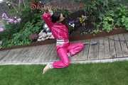 Watching Aiyana wearing supersexy pink shiny nylon rainwear while planting flowers in the garden (Pics)