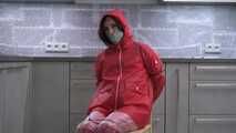 Miss Amira in red nylon rain gear and tranparent rain suit get´s bouind and gagged