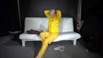 Watching Pia preparing her sofa with a shiny nylon cloth wearing a yellow shiny nylon rainsuit enjoying herslef on the sofa (Video)