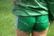 Watching sexy Sandra wearing a sexy green shiny nylon shorts and a green shiny nylon rain jacket enjoying the garden shower (Pics)