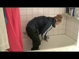 Jenny taking a shower in her flat wearing sexy shiny nylon rainwear (Video)