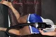 Watching sexy Pia wearing a sexy blue/white oldschool shiny nylon shorts and a muscle shirt assembling a vaccum cleaner and cleaning with it the sofa (Pics)