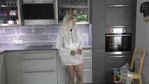 Miss Francine in sexy PVC shorts, white K-Way rainjacket and transparent raingear