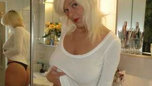 Natural beauty Martina posing in white shirt, black thong and stockings in bathroom