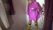 Watching Sandra wearing only a pink shiny nylon raincape under the shower playing with the water (Video)