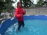 Watch Sandra enjoying the Pool during a hot summer Day with her shiny nylon Downjacket