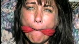 38 Yr OLD CASHIER IS MOUTH STUFFED, CLEAVE GAGGED, BALL-GAGGED, BAREFOOT, TOE-TIED, BLINDFOLDED & HANDGAGGED (D57-15)