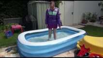 Watching Mara wearing a supersexy purple down skirt and a purple down jacket cleaning the swimming pool and playing with water (Video)