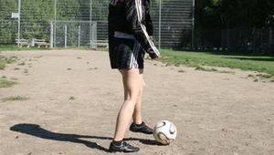 Leonie playing soccer outdoor wearing a sexy black shiny nylon shorts and a sexy black rain jacket (Pics)