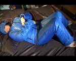 Jill putting on a sexy blue shiny nylon down suit and lolling on bed (Pics)