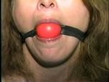 ONE BABE TAPE BOUND, BALL-GAGGED & DROOLING (D26-3)