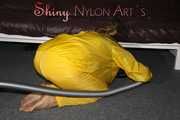 Watching sexy Sandra wearing a hot yellow shiny nylon rainwear combination during her housework (Pics)