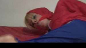 Video with Pia tied and gagged in shiny nylon rainwear