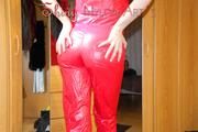 Lucy wearing a supersexy red adidas rainwear jumpsuit while posing infront of the mirror showing all she have (Pics)