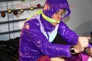 Pia wearing a pink rain pants and a purple down jacket tied with cuffs and gagged on bed (Pics) 