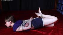 Agnes hogtied on bed