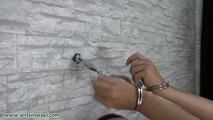 Handcuffed to the wall