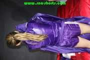 Sandra preparing her shiny nylon bed wearing sexy purple shiny nylon shorts and a purple shiny nylon rain jacket (Pics)