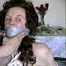 69 yr OLD TAPE WRAP GAGGED, HUMILIATED TOPLESS HOSTAGE (D14-4)
