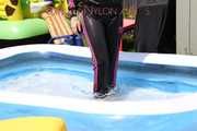 Watching sexy Mara going into the swimming pool wearing a sexy black/pink rainwear combination (Pics)